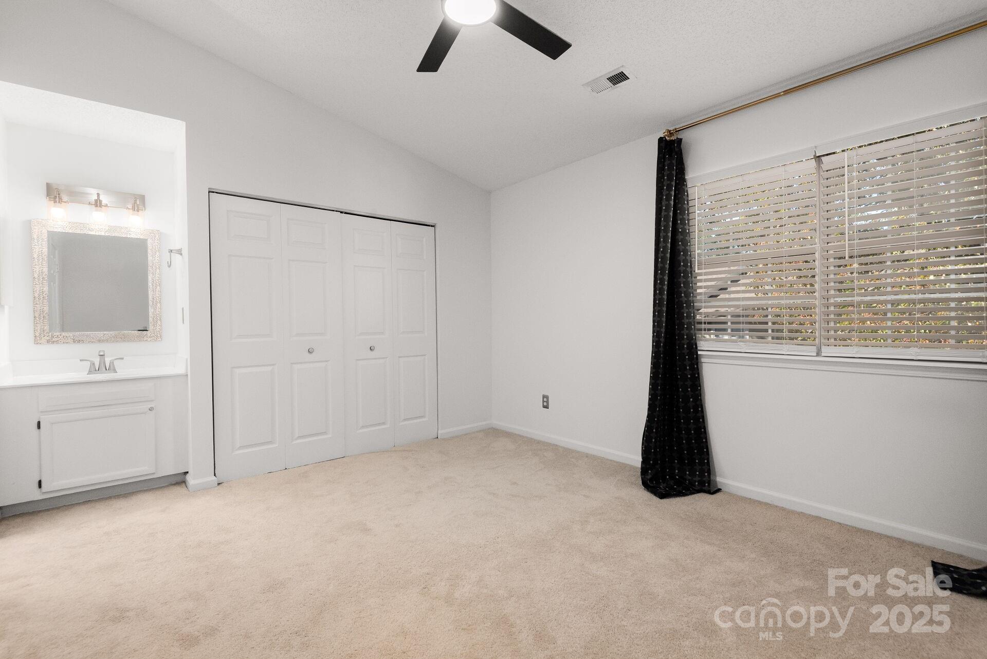 9204 4 Mile Creek Road Charlotte, NC 28277 - Photo 10 of 18 a view of an empty room with cabinet and a window