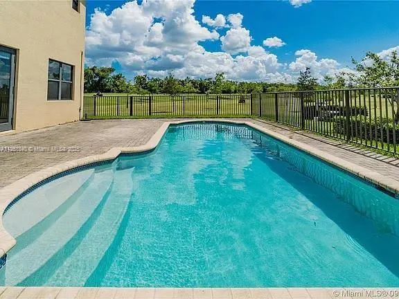 a view of swimming pool from a balcony
