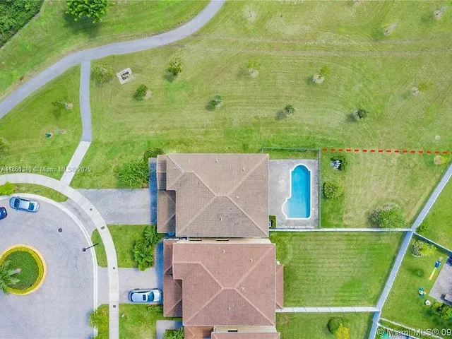 a view of a bathroom with a sink and mirror