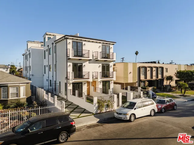 a view of a street with cars