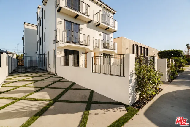 a view of a house with a street