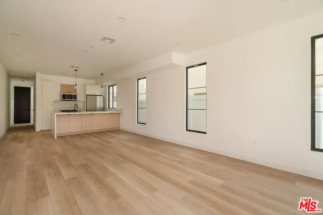 a view of a room with cabinet and windows