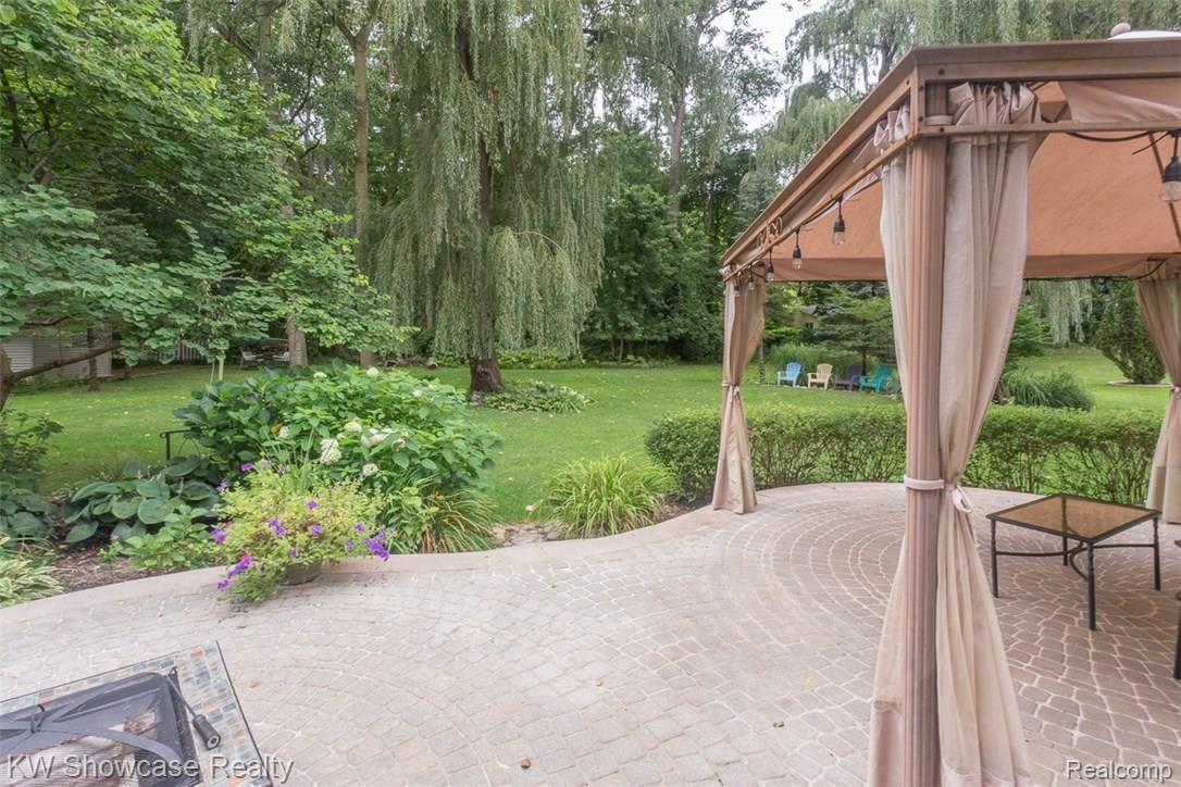 16897 Ryan Road Livonia, MI 48154 - Photo 30 of 34 Spacious backyard with brick paver patio, grill and cabana.