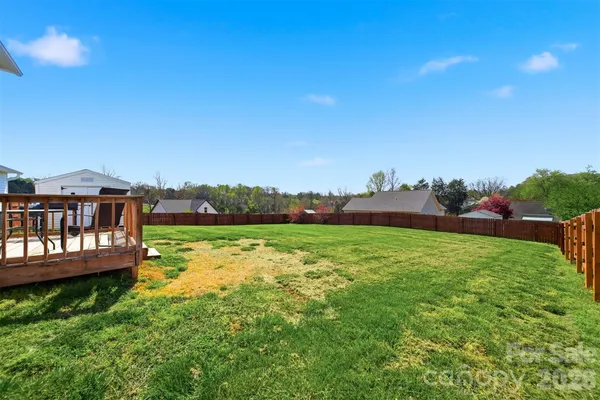 a view of a lake with a yard