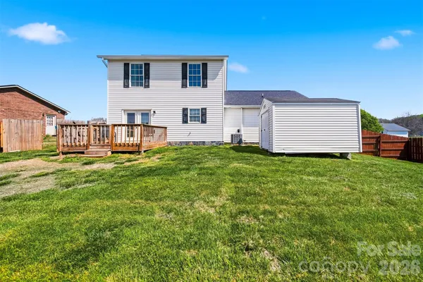 a house view with a play ground in front of it