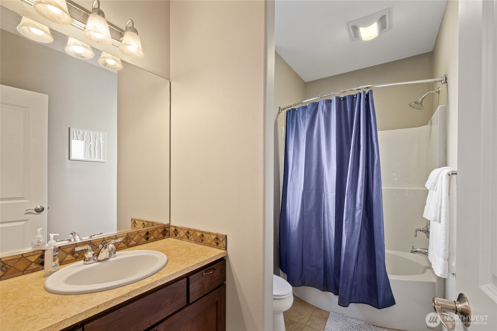 23041 Sunserra Loop Quincy, WA 98848 - Photo 18 of 38 a bathroom with a sink vanity mirror and toilet