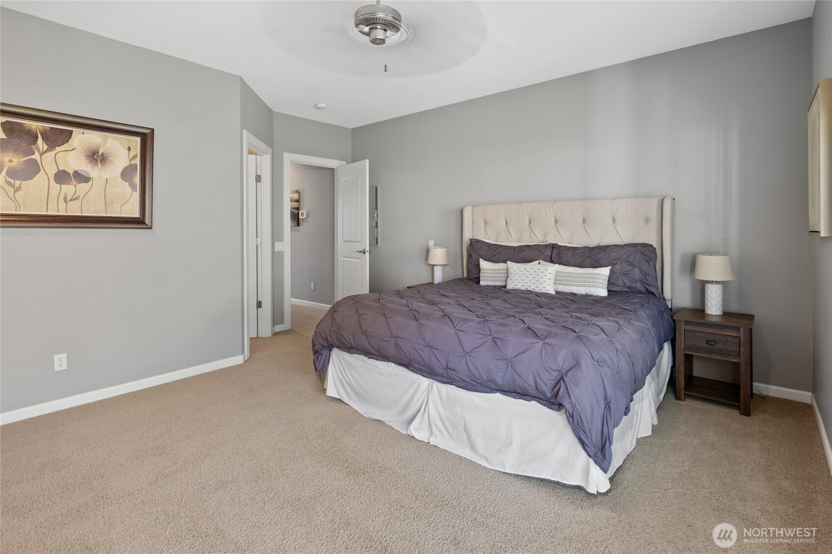 23041 Sunserra Loop Quincy, WA 98848 - Photo 21 of 38 a spacious bedroom with a bed and wall painting