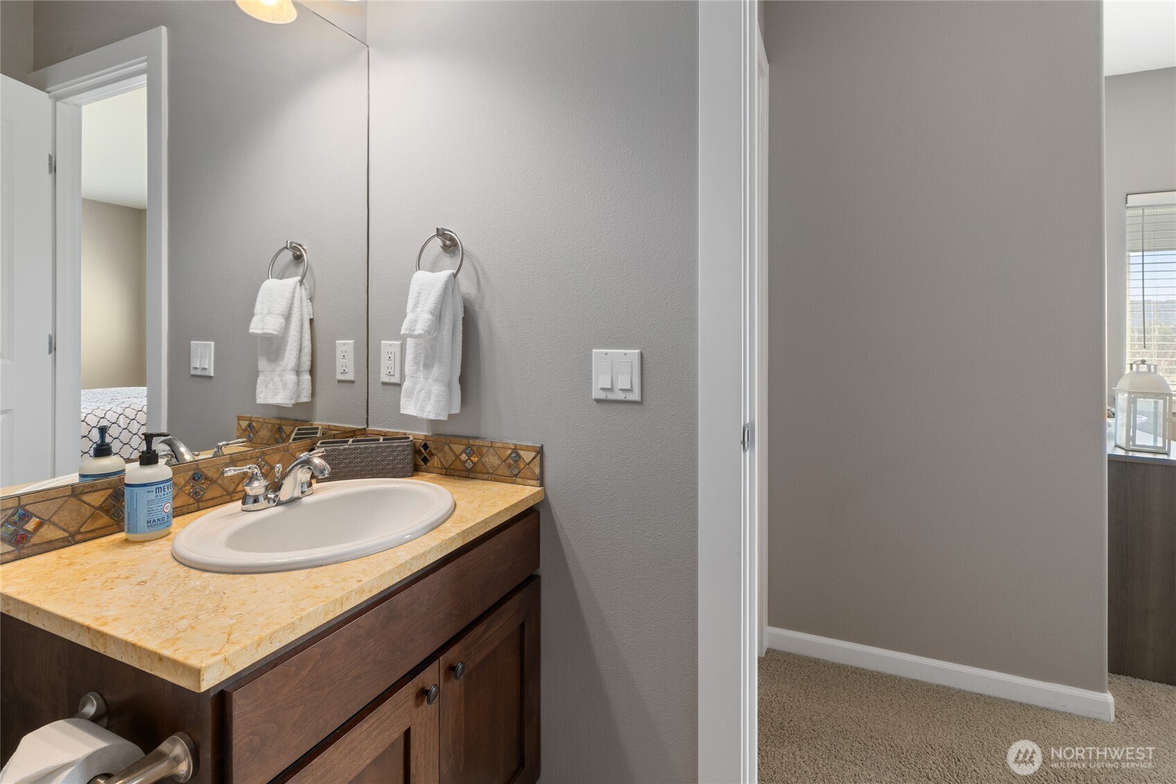23041 Sunserra Loop Quincy, WA 98848 - Photo 30 of 38 a bathroom with a sink and a mirror