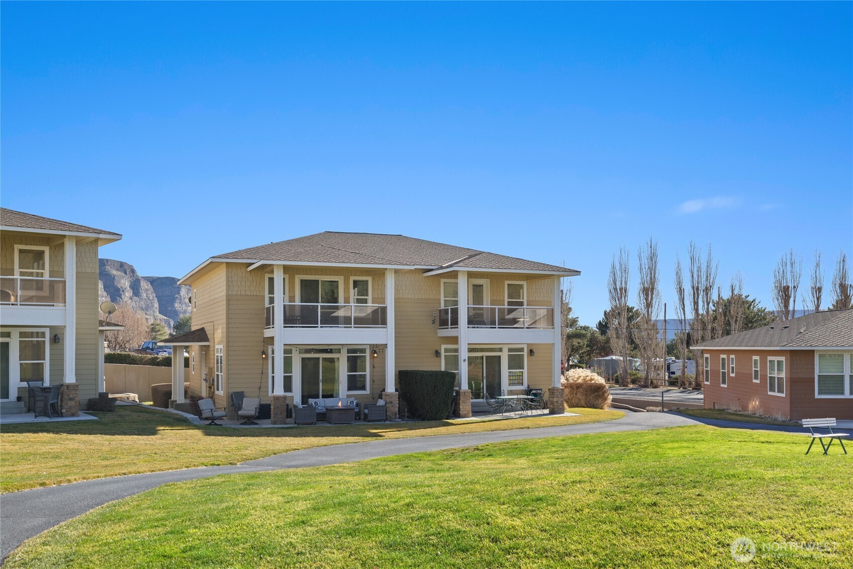 23041 Sunserra Loop Quincy, WA 98848 - Photo 5 of 38 a front view of a building with a garden