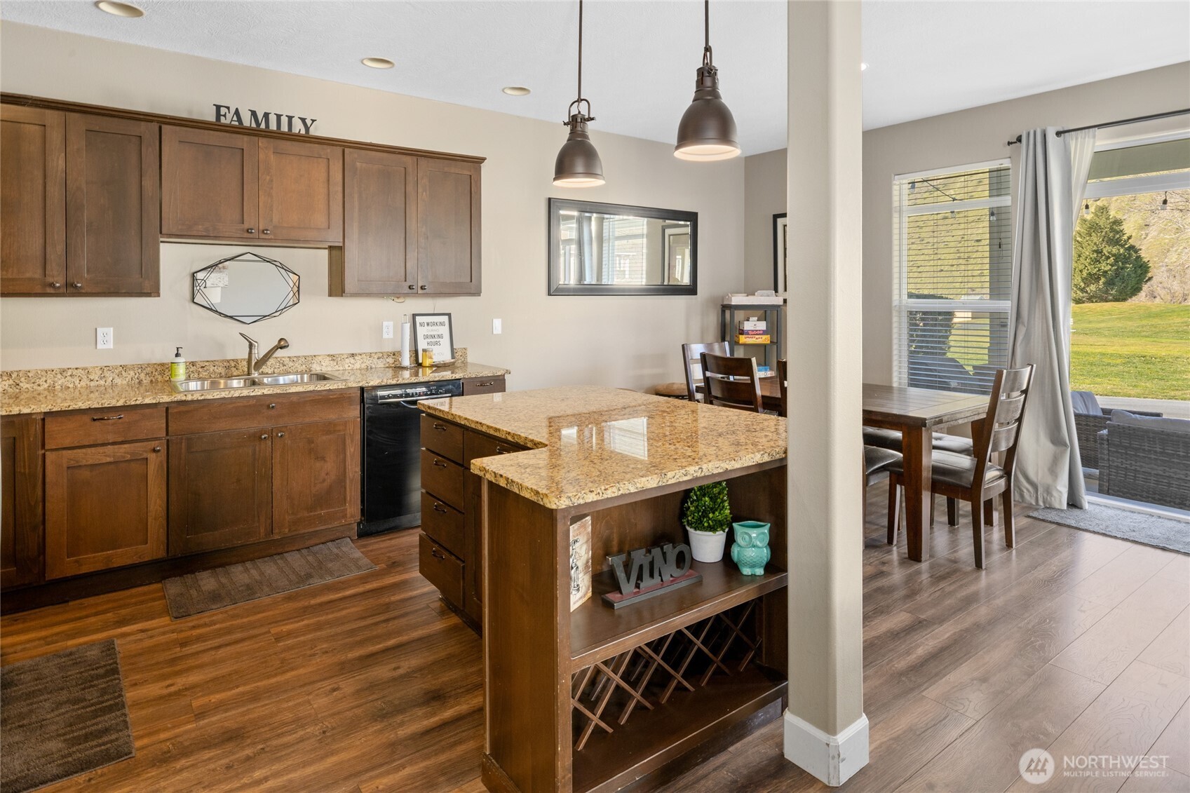 23041 Sunserra Loop Quincy, WA 98848 - Photo 8 of 38 a kitchen with a stove a sink and a refrigerator