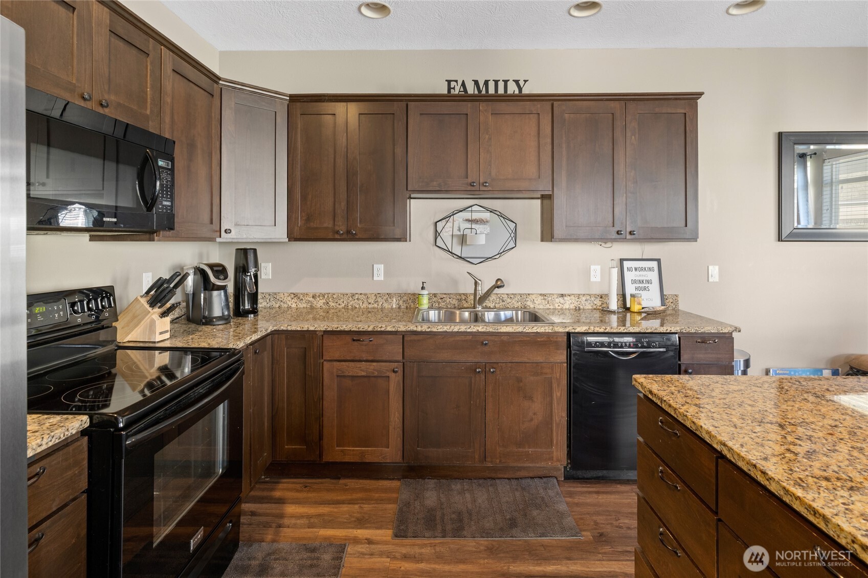23041 Sunserra Loop Quincy, WA 98848 - Photo 9 of 38 a kitchen with granite countertop a sink a stove and cabinets