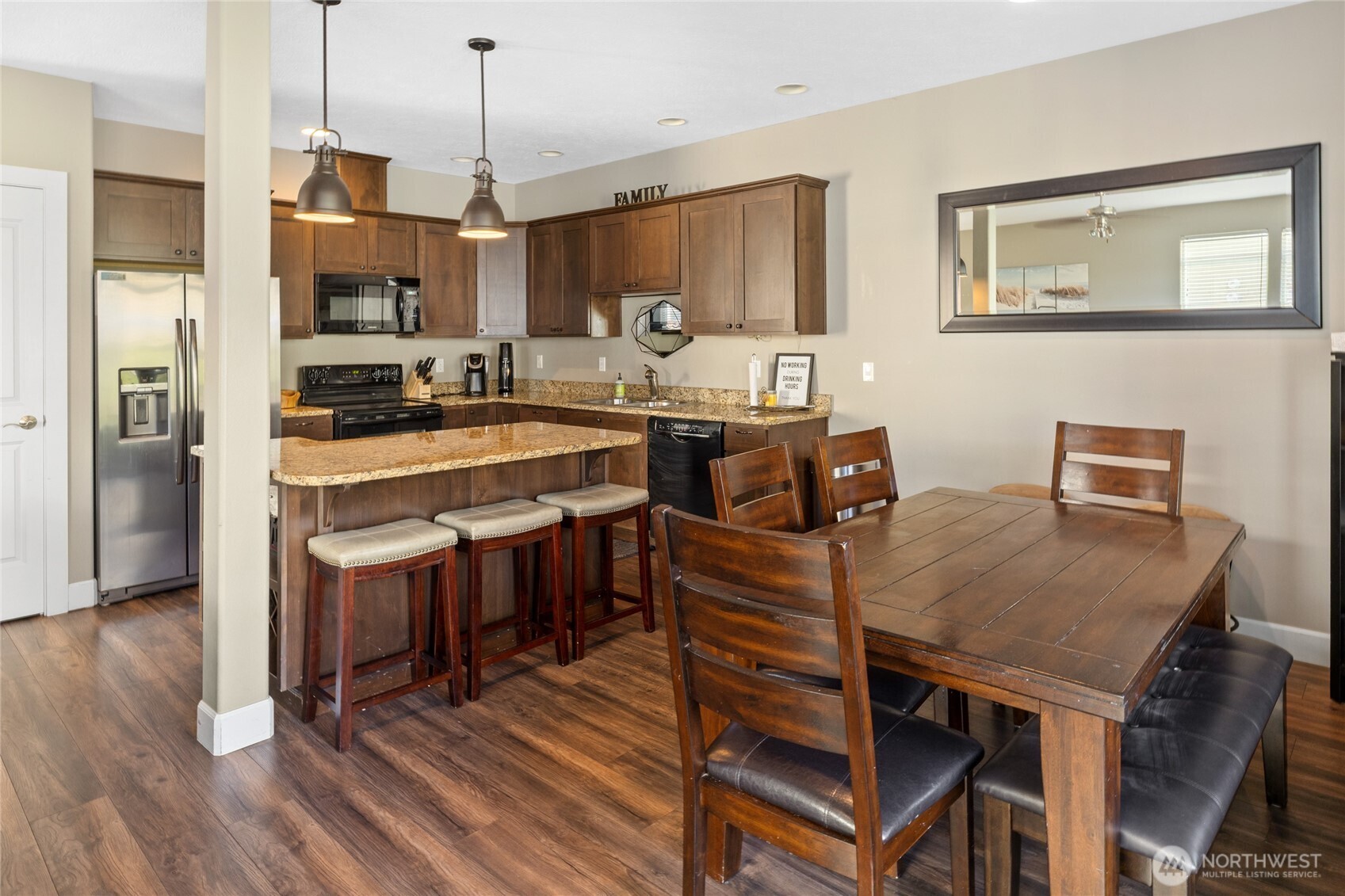 23041 Sunserra Loop Quincy, WA 98848 - Photo 10 of 38 a large kitchen with a table and chairs