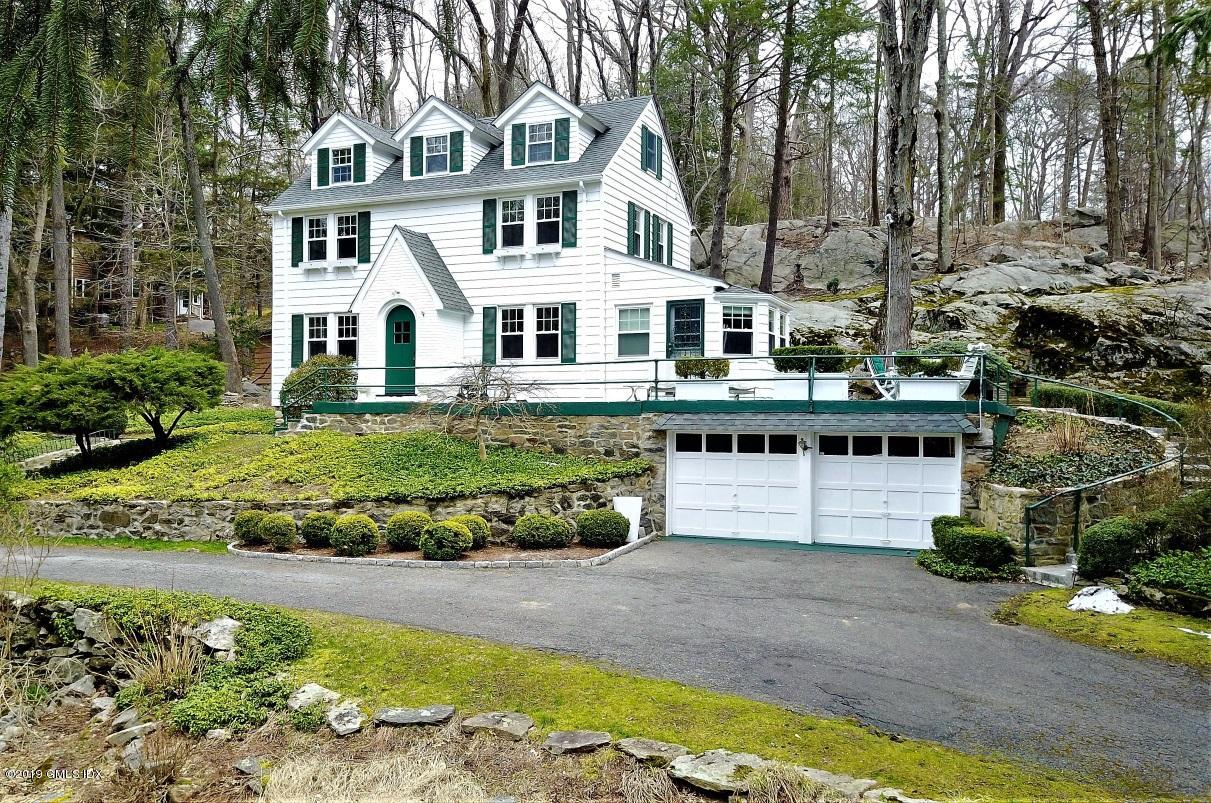 347 Riversville Road Greenwich, CT 06831 - Photo 1 of 22 a front view of a house with a yard