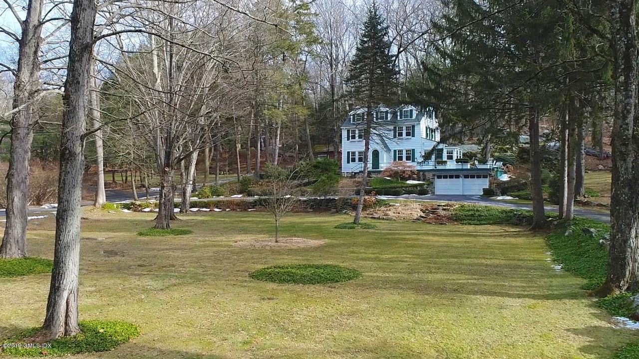 347 Riversville Road Greenwich, CT 06831 - Photo 2 of 22 a swimming pool with outdoor seating and yard