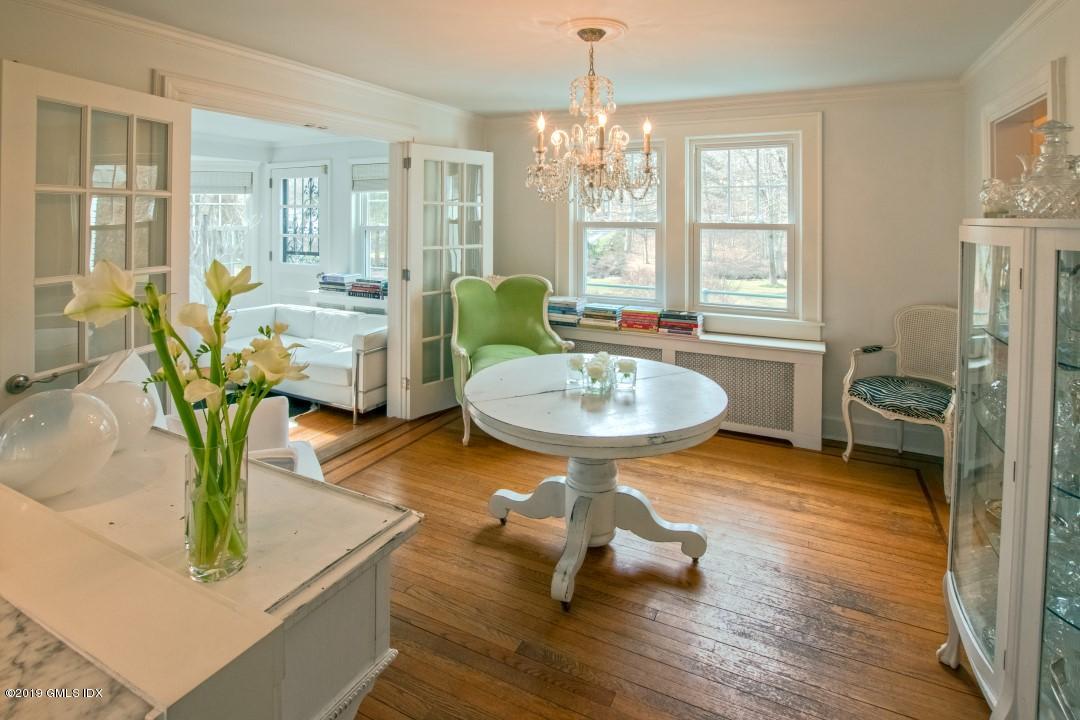 347 Riversville Road Greenwich, CT 06831 - Photo 7 of 22 a living room with furniture and a chandelier