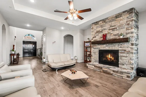 a living room with furniture and kitchen view