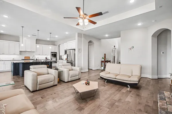 a living room with furniture or couches and a large window