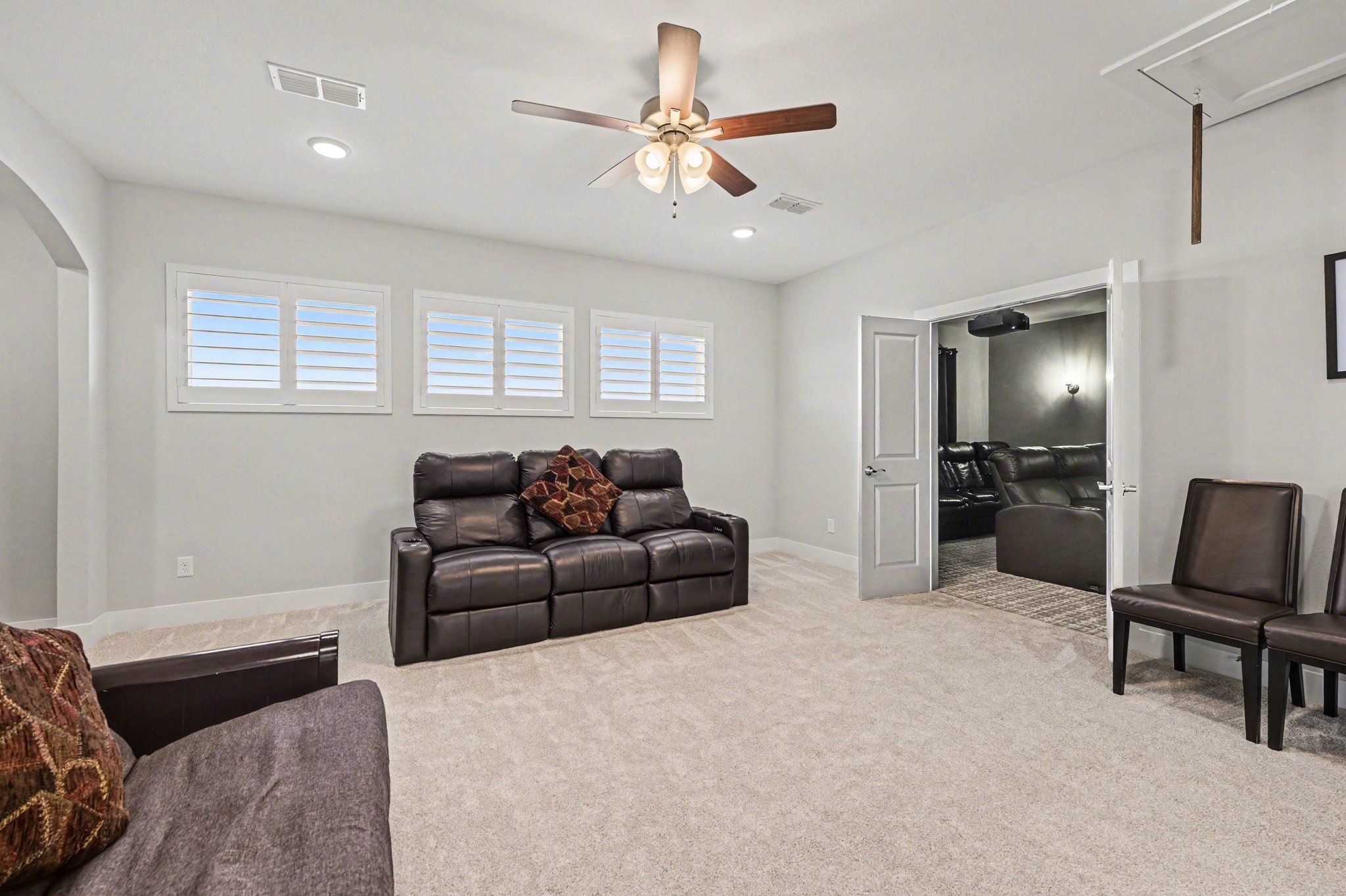 2311 Legends Way Katy, TX 77493 - Photo 22 of 50 Spacious upstairs retreat ideal for a game room, secondary living area, or flex space. Plush carpeting and abundant natural light create a comfortable gathering space for family and guests.