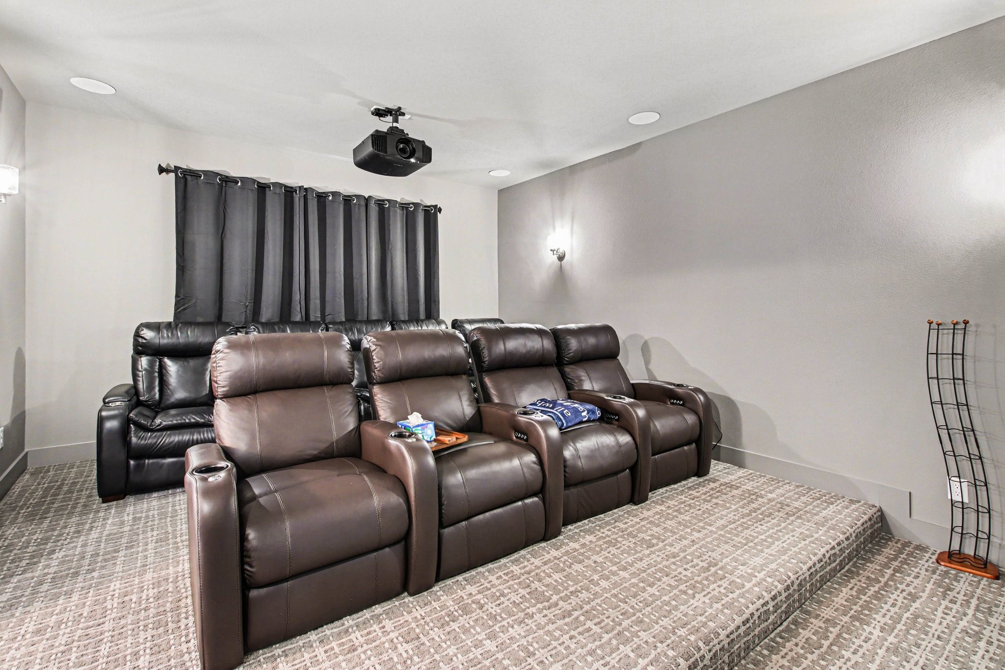 2311 Legends Way Katy, TX 77493 - Photo 24 of 50 Dedicated media room designed for the ultimate movie night with tiered seating, projector, and large screen—perfect for entertaining family and friends.
