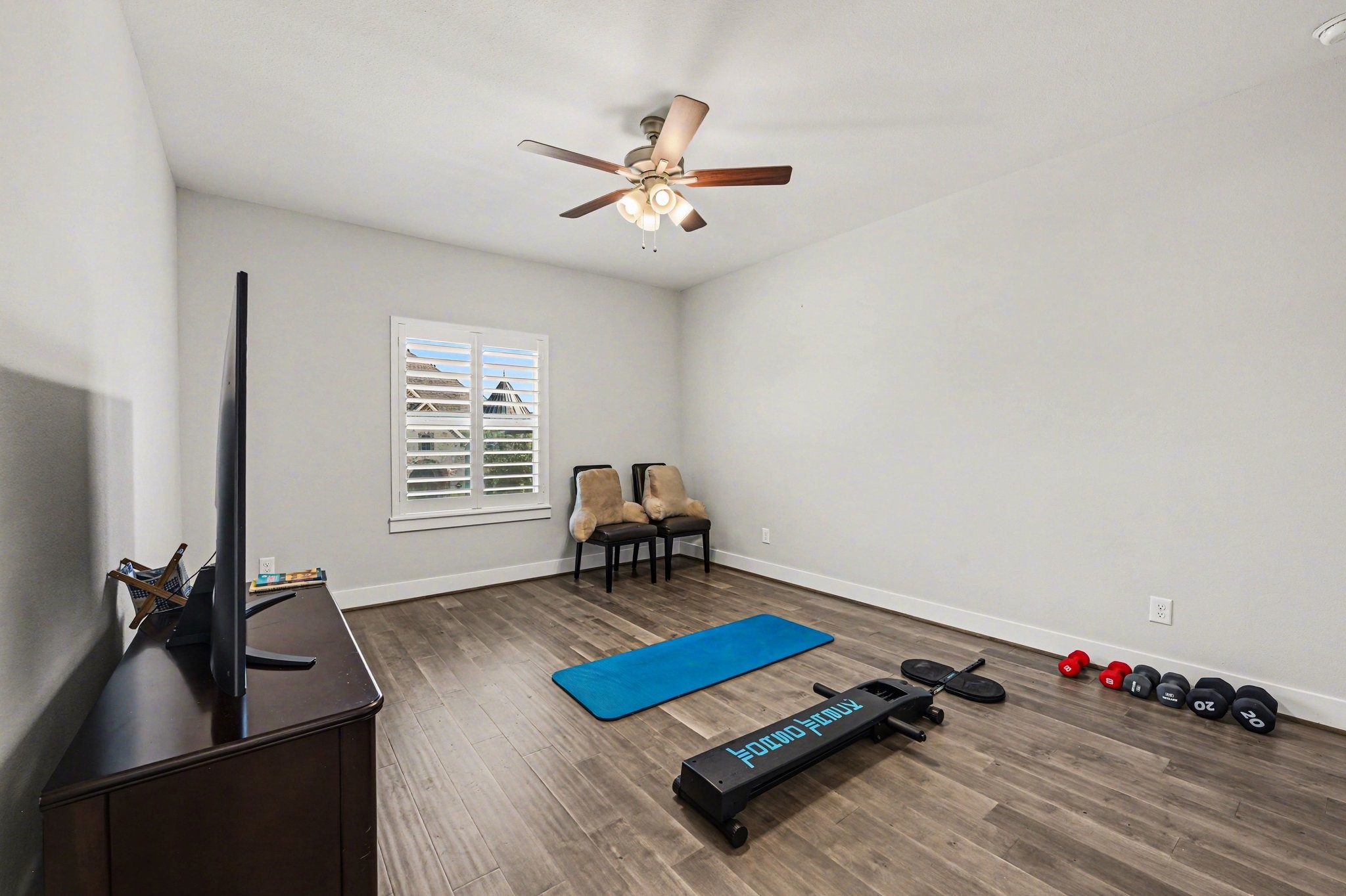 2311 Legends Way Katy, TX 77493 - Photo 39 of 50 Versatile bedroom with durable wood flooring—perfect for a home gym, media room, playroom, or secondary living area. The options here are endless.