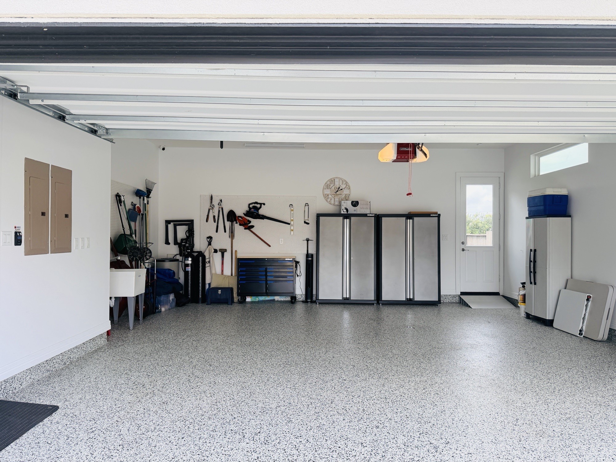 2311 Legends Way Katy, TX 77493 - Photo 45 of 50 Large 4-car garage offering extensive storage options, wall-mounted organization systems, and plenty of room for vehicles and gear.