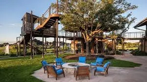 an aerial view of a residential houses with outdoor space