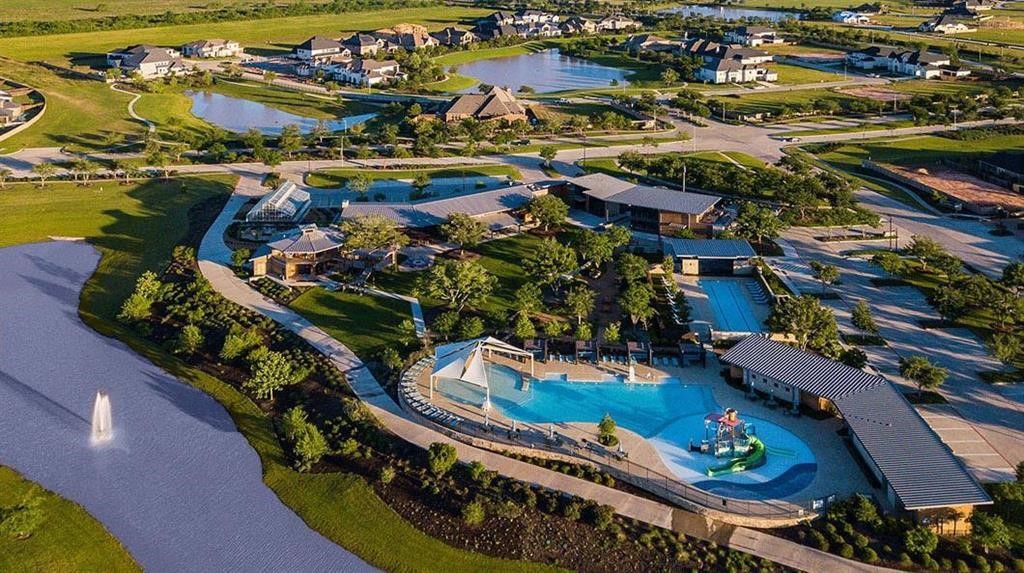 2311 Legends Way Katy, TX 77493 - Photo 50 of 50 Resort-style community pool and amenity center surrounded by scenic lakes, walking trails, and beautifully landscaped green spaces.