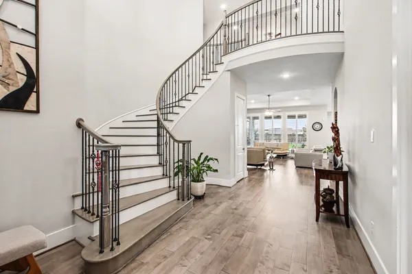 a view of entryway with wooden floor
