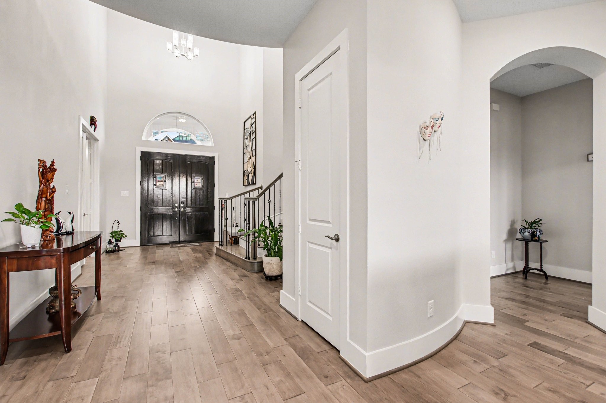 2311 Legends Way Katy, TX 77493 - Photo 7 of 50 Grand double doors and an open-concept design create a seamless flow into the heart of the home. Natural light and architectural details make this entry both welcoming and refined.