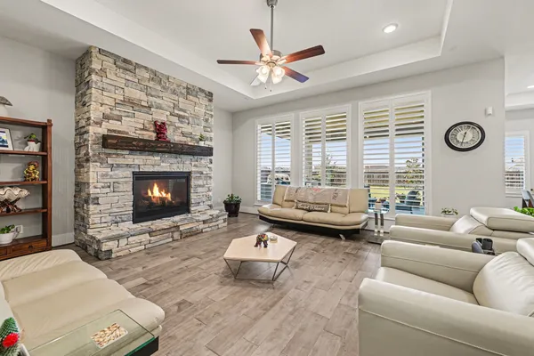 a living room with furniture and kitchen view