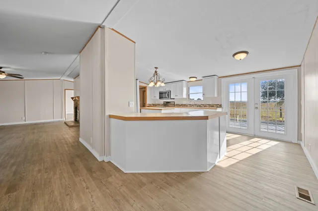 a view of kitchen with wooden floor