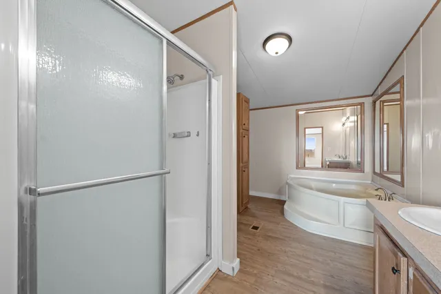 a bathroom with a bathtub and a shower