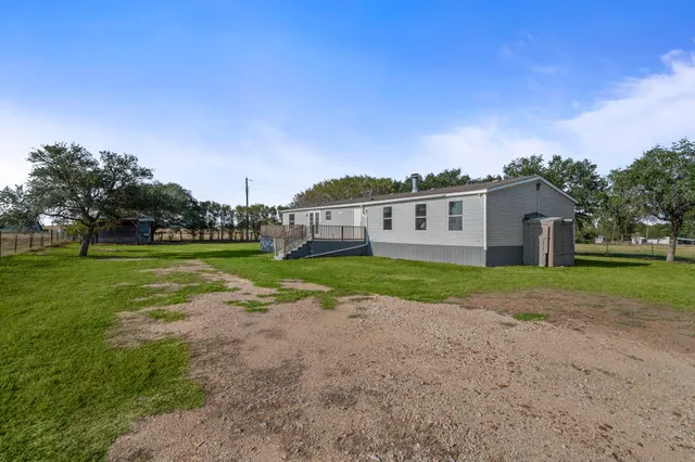 a view of a house with a big yard