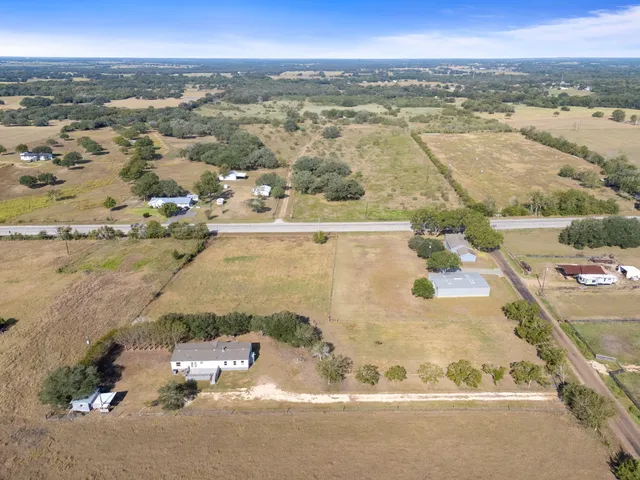 an aerial view of residential building and ocean