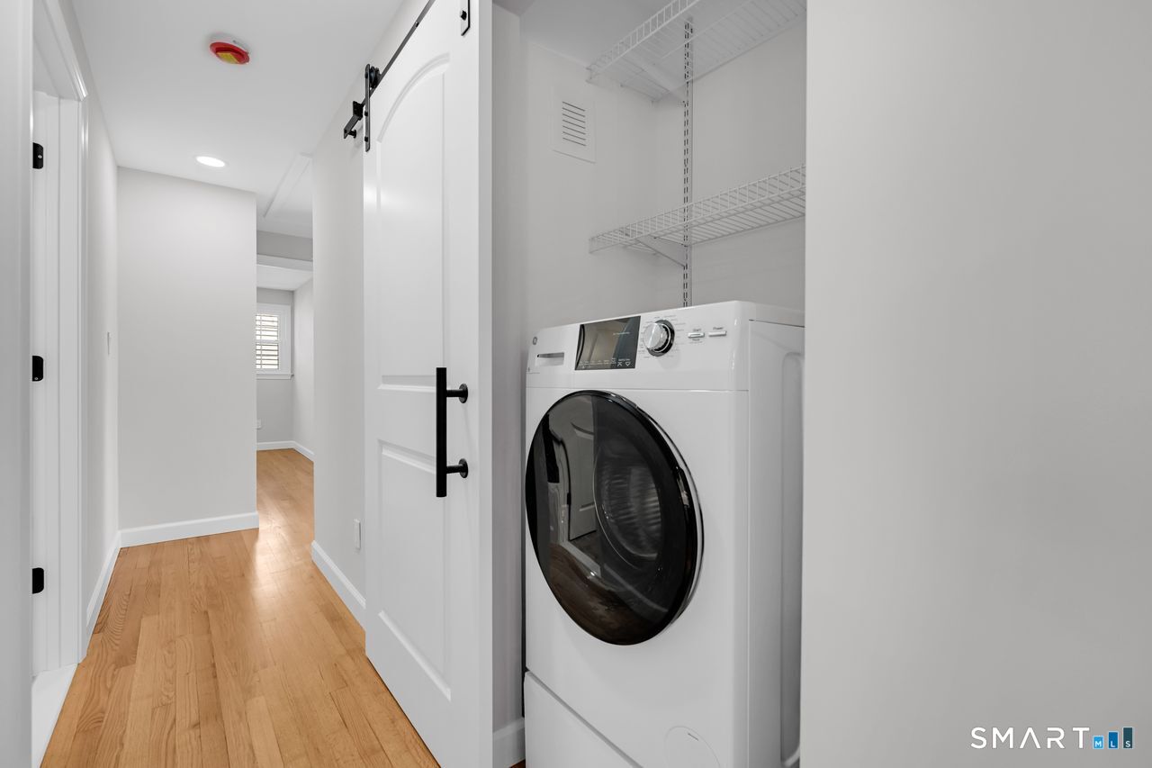 129 Midwell Road Wethersfield, CT 06109 - Photo 9 of 28 Convenient laundry on the main level. Combination washer/dryer all in one!