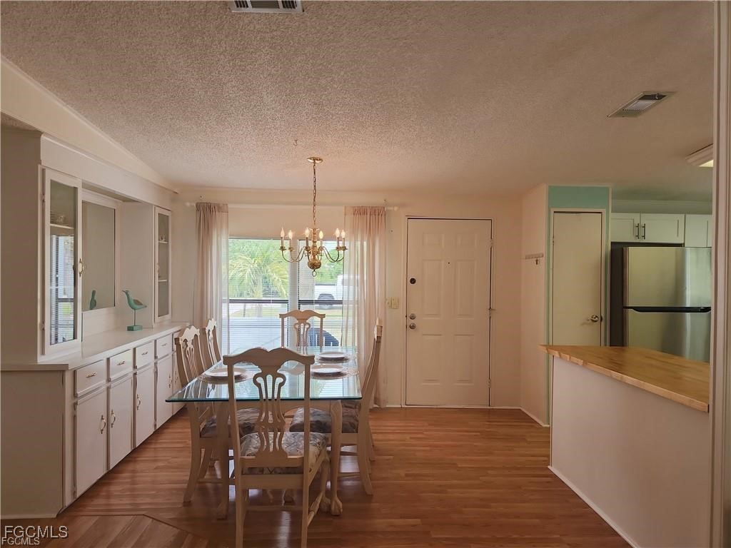 10401 Circle Pine Road North Fort Myers, FL 33903 - Photo 12 of 20 a view of a kitchen from the hallway