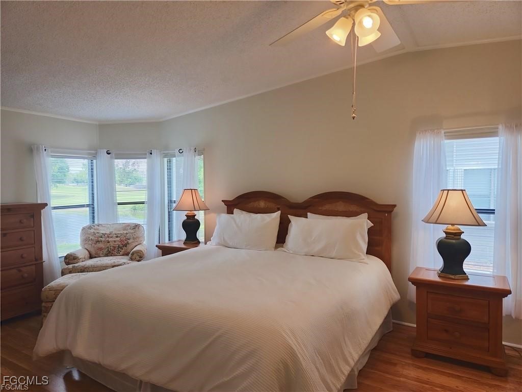 10401 Circle Pine Road North Fort Myers, FL 33903 - Photo 14 of 20 a bedroom with a bed and window