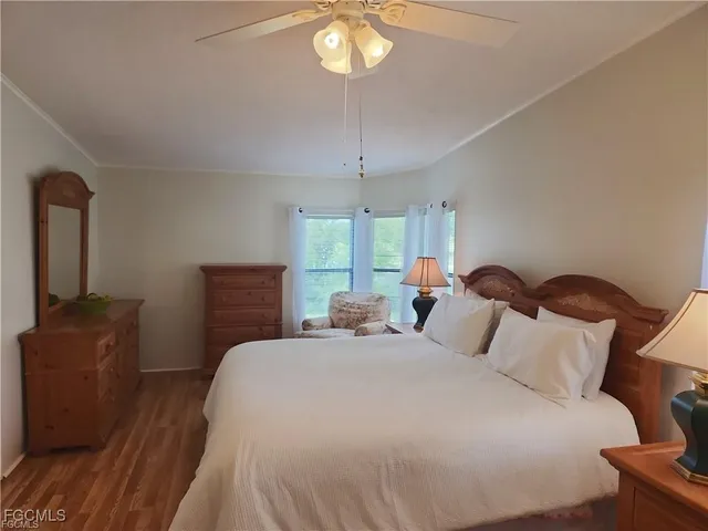 a bedroom with bed and window