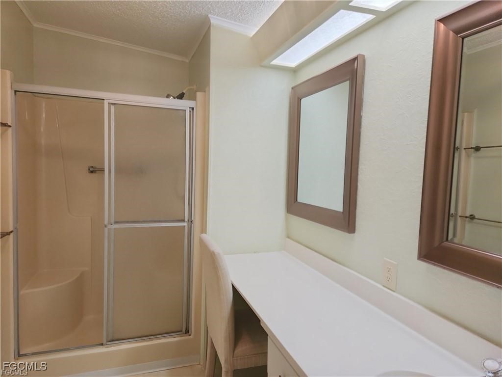 10401 Circle Pine Road North Fort Myers, FL 33903 - Photo 16 of 20 a bathroom with a bathtub and a shower