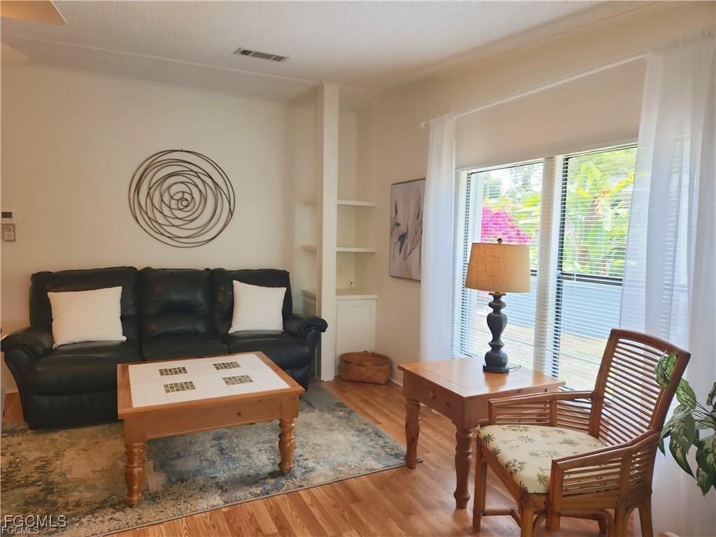 10401 Circle Pine Road North Fort Myers, FL 33903 - Photo 9 of 20 a view of a livingroom with furniture and window