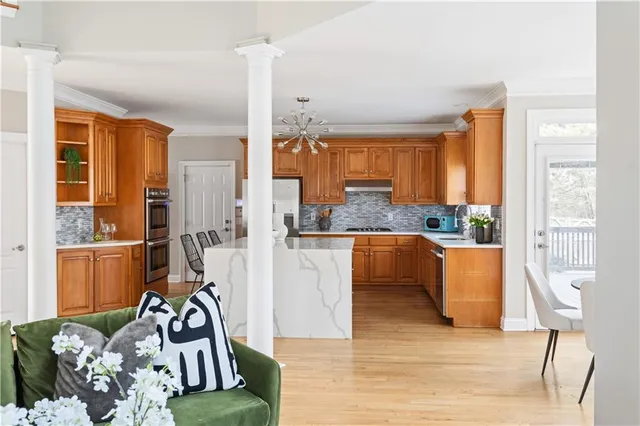 a view of a dining room with furniture windows and wooden floor