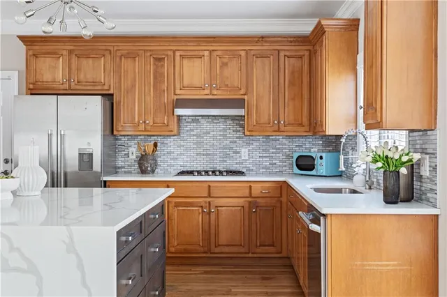 a kitchen with a sink and a refrigerator