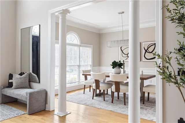 a view of a dining room with furniture window and wooden floor