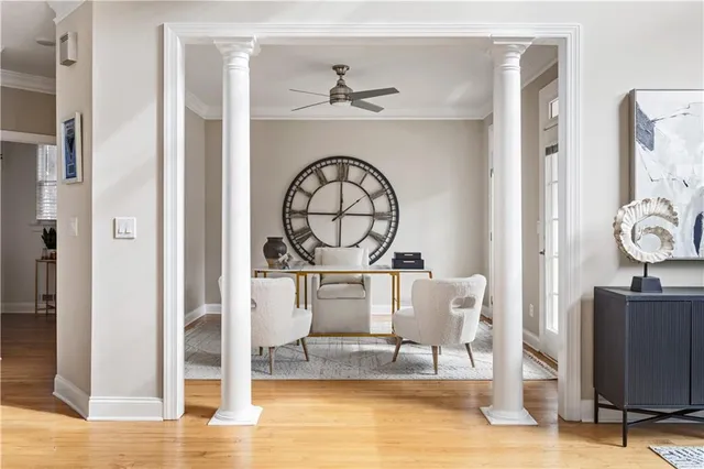a living room with furniture a table and a large window