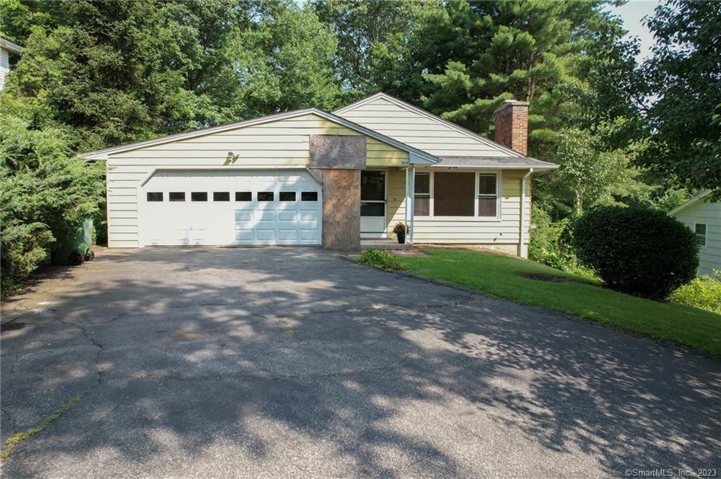 174 Juniper Ridge Drive Waterbury, CT 06708 - Photo 1 of 1 a view of a house with a yard and large trees