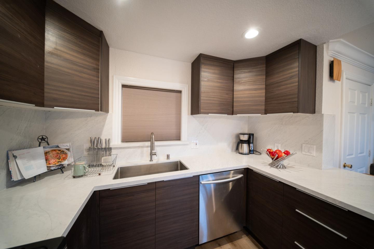 301 Channing Way Pacifica, CA 94044 - Photo 10 of 68 a kitchen with a sink cabinets and a window