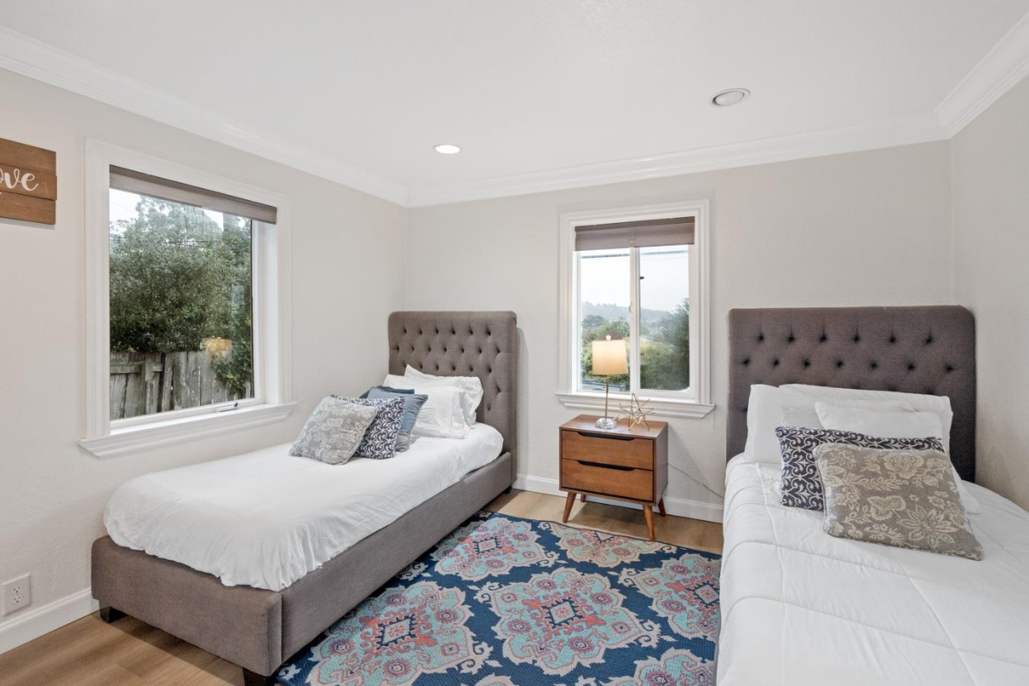 301 Channing Way Pacifica, CA 94044 - Photo 30 of 68 a bedroom with a bed and a window