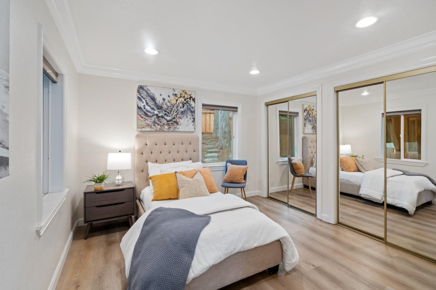 301 Channing Way Pacifica, CA 94044 - Photo 33 of 68 a bedroom with a bed and wooden floor