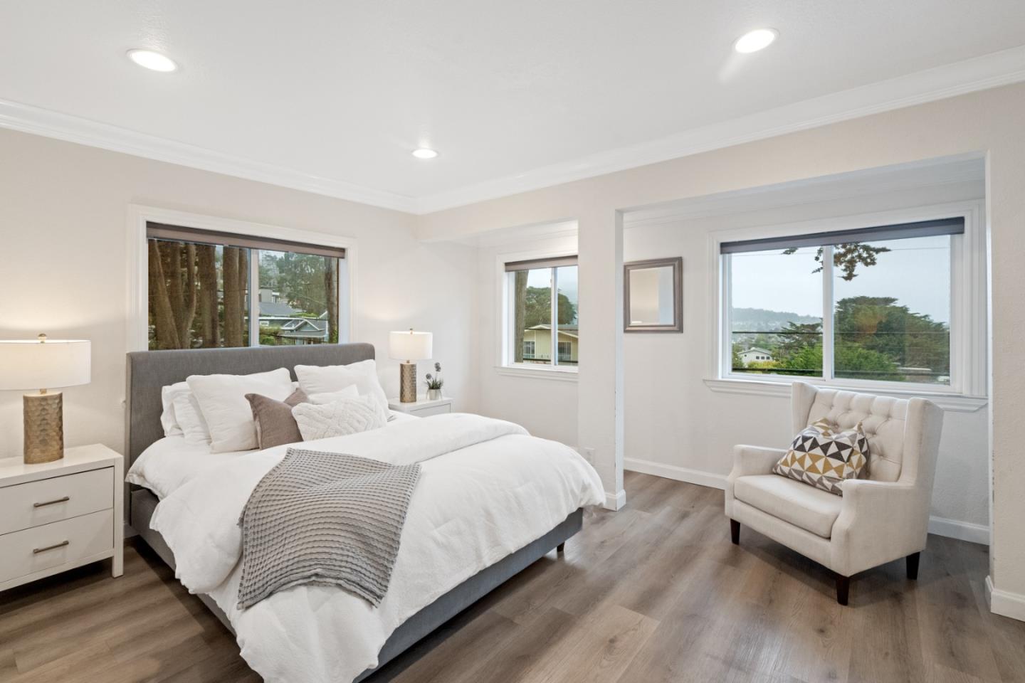 301 Channing Way Pacifica, CA 94044 - Photo 44 of 68 a bedroom with a bed and wooden floor