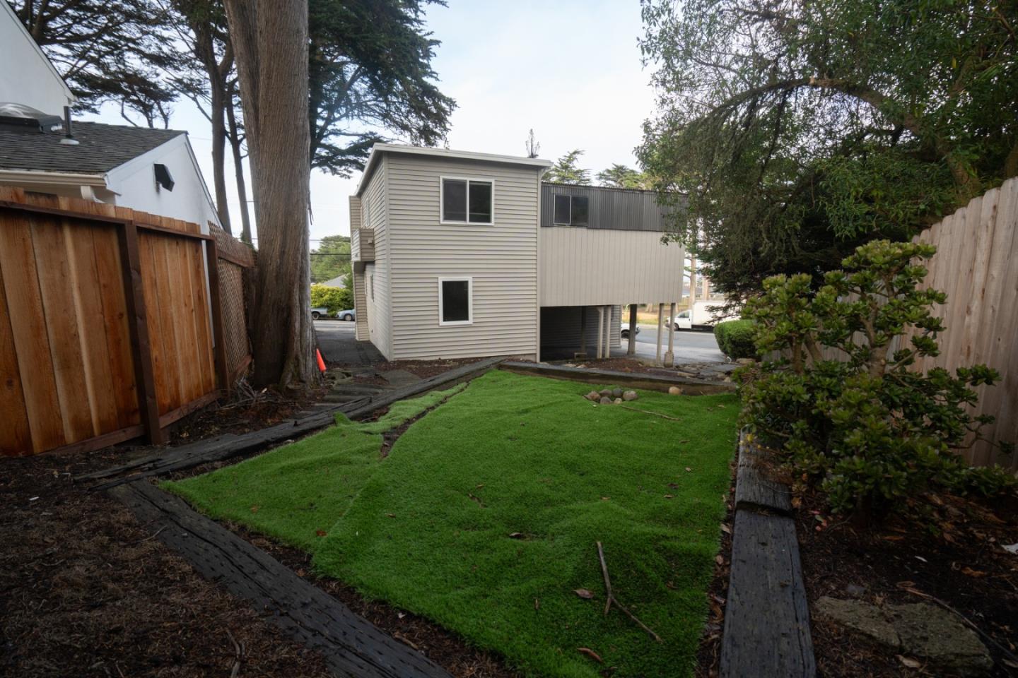 301 Channing Way Pacifica, CA 94044 - Photo 50 of 68 a view of a house with backyard and sitting area
